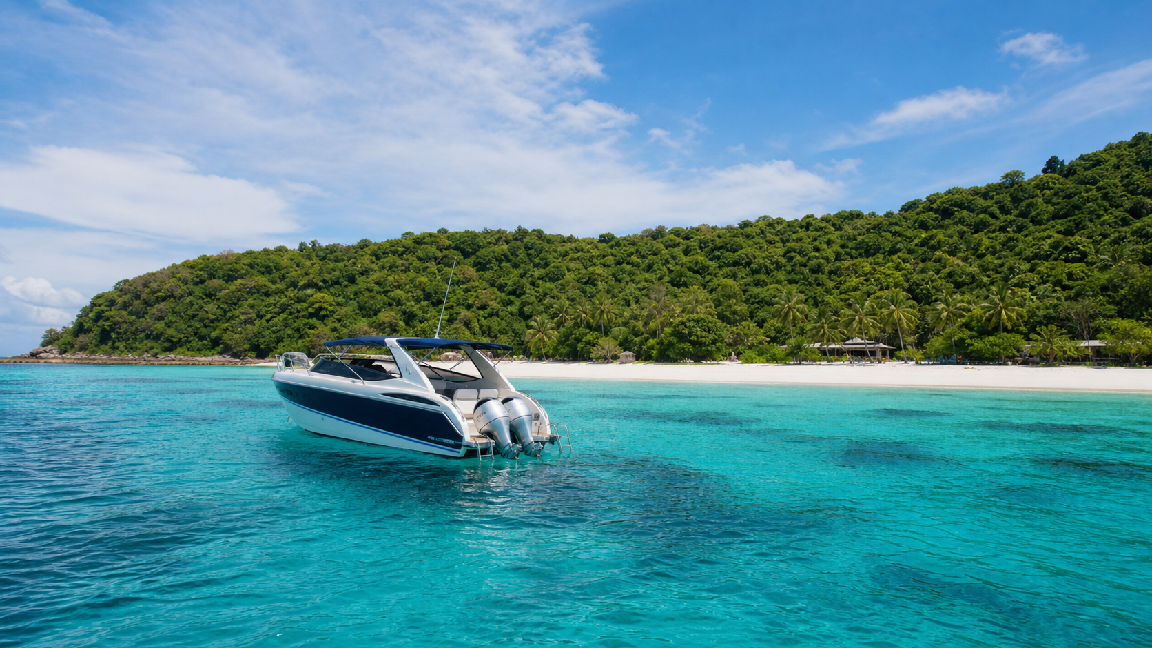 Koh Bon beach near Rawai with clear water and a longtail boat