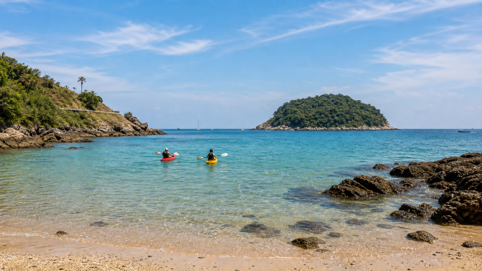 Kayaks heading from Ya Nui Beach toward Koh Man island in calm turquoise water